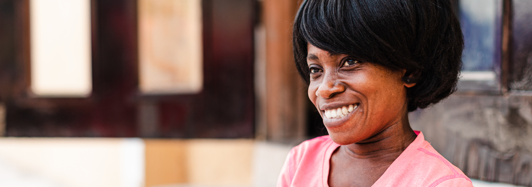 An African woman in Ghana is smiling